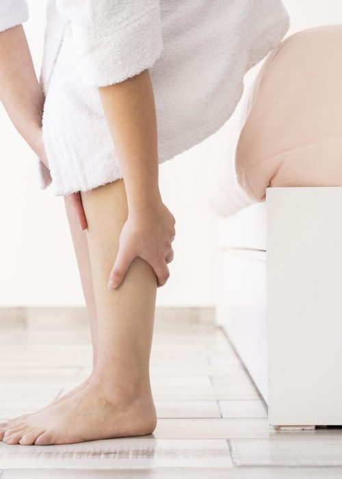 close-up-hands-massaging-legs