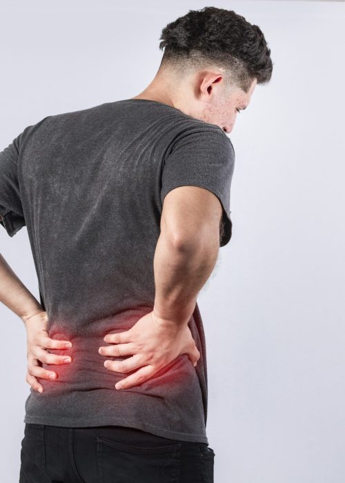 Man with spine problems, person with back problems on isolated background, lumbar problems concept, a sore man with back pain
